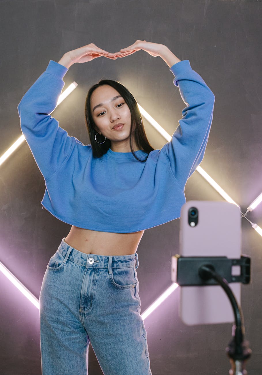 Creator filming TikTok Boom Clap trend showing positive reaction and text overlay