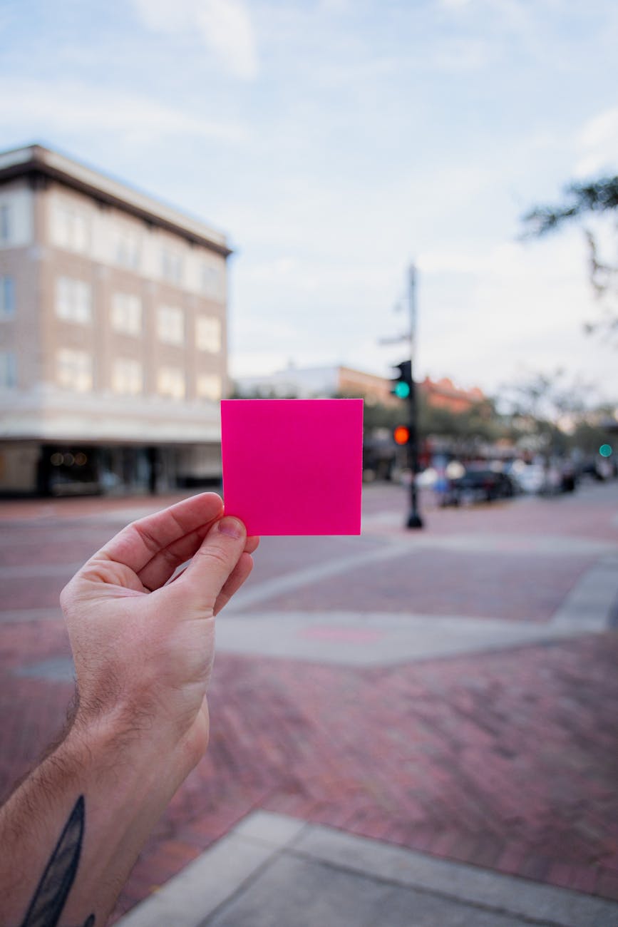 A hand holding a note with 