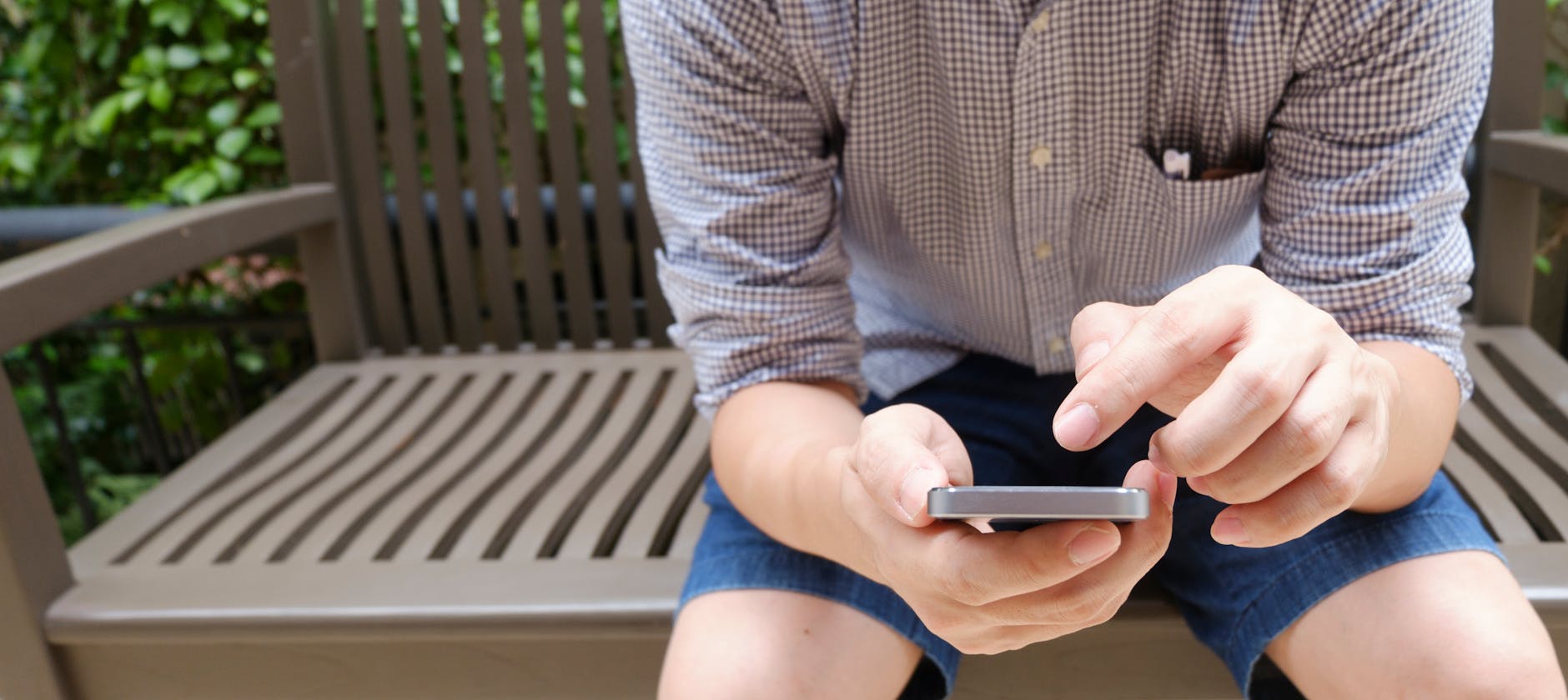 Person scrolling through short-form video content on mobile device